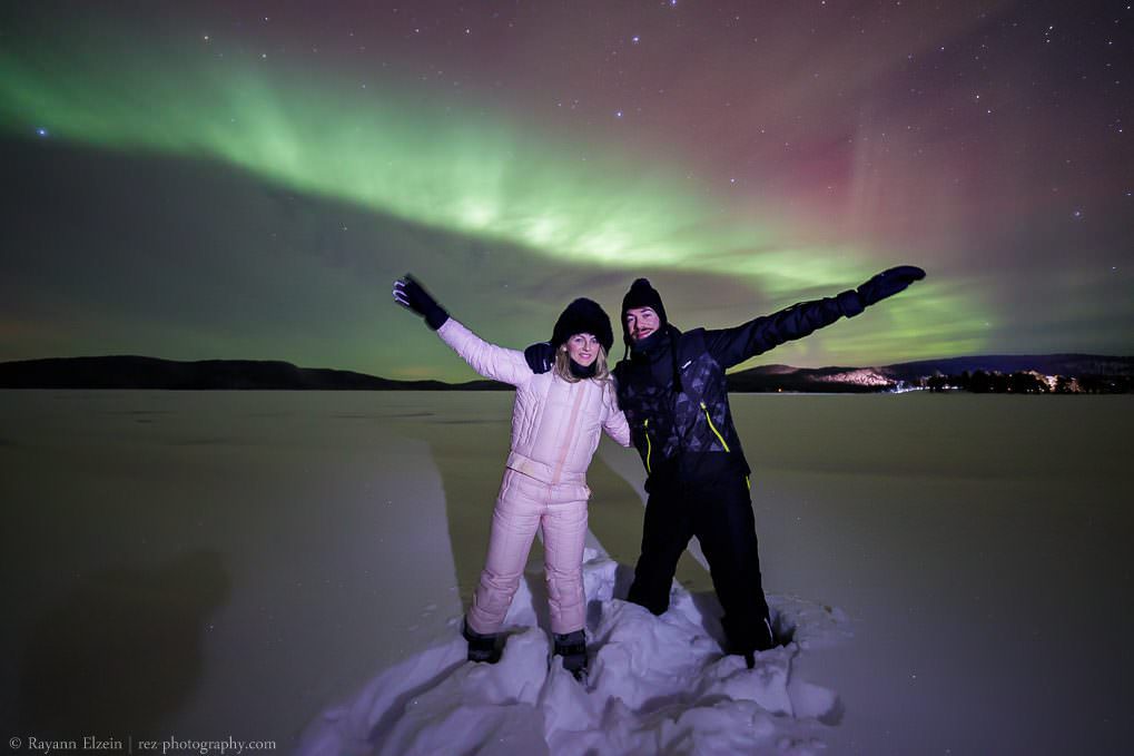 Italian guests enjoying the northern lights in Finnish Lapland