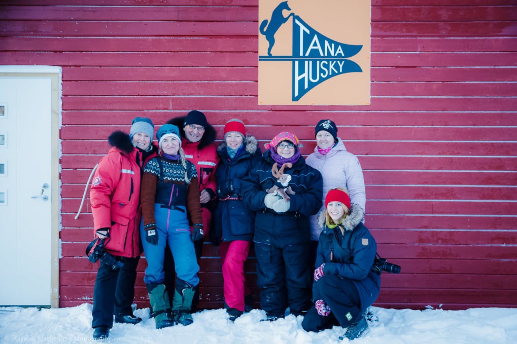Workshop participants posing together in front of the Tana Husky building